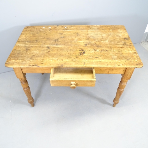 2549 - A pitch pine plank top farmhouse kitchen table, with single frieze drawer and raised on turned legs.... 