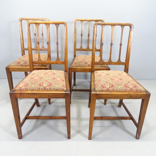 2552 - A set of four early 20th century walnut dining chairs with upholstered drop-in seats.