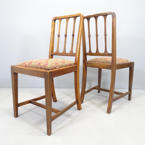 2552 - A set of four early 20th century walnut dining chairs with upholstered drop-in seats.