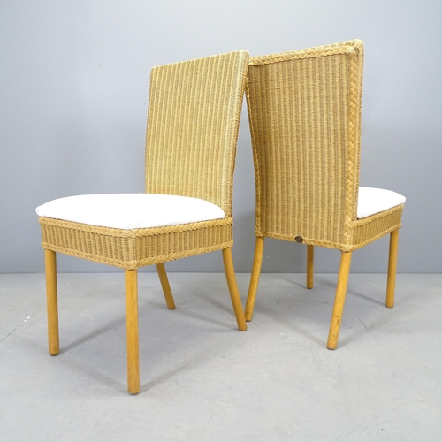 2555 - A set of four Lloyd Loom wicker dining chairs