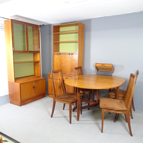 2560 - A mid-century teak G-plan dining room suite comprising a drop-leaf table, 106x72x31cm, four matching... 