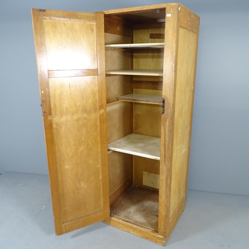 2561 - An early 20th century oak single door locker, with shelved interior. 60x172x58cm.