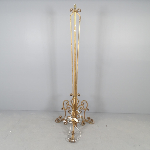 2562 - A gilt-painted wrought metal standard lamp. Height to bayonet fitting 164cm.