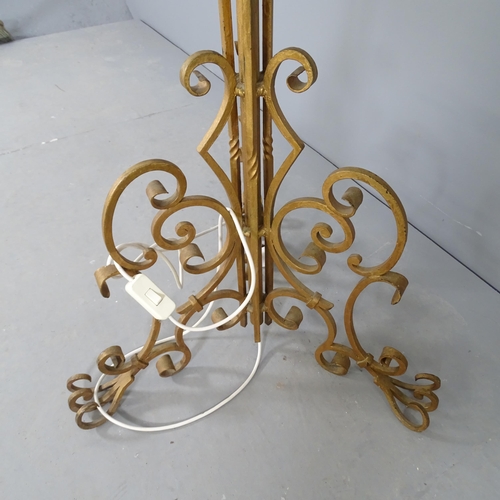 2562 - A gilt-painted wrought metal standard lamp. Height to bayonet fitting 164cm.