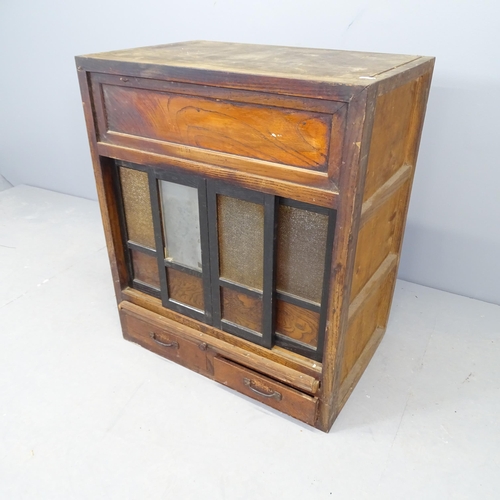 2567 - A Japanese elm alter cabinet, with sliding doors and two frieze drawers. 64x76x42cm