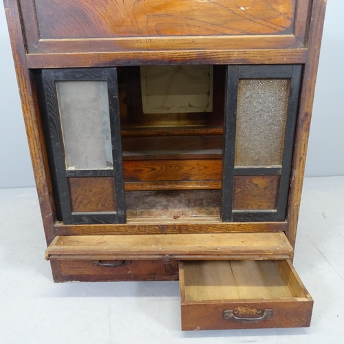 2567 - A Japanese elm alter cabinet, with sliding doors and two frieze drawers. 64x76x42cm