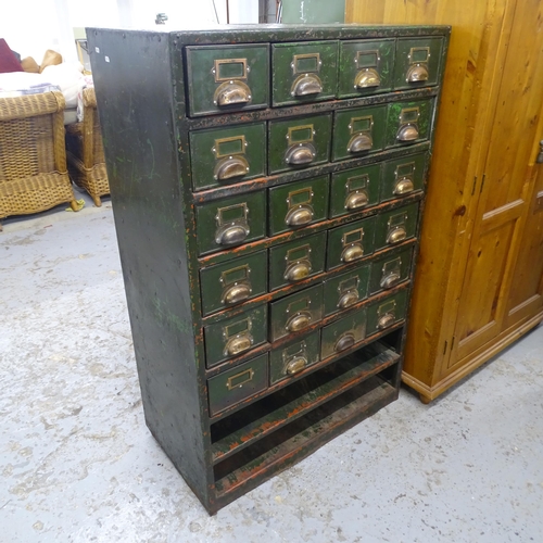 2580 - A vintage painted metal bank of filing drawers. 92x143x50cm.