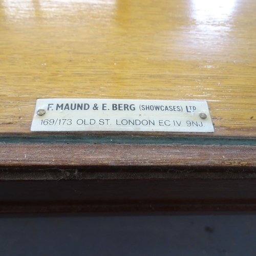 2581 - An antique oak framed glazed shop display cabinet by F. Maund and E. Berg (showcases) Ltd. of London... 