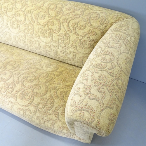 2585 - A modern cream three seater sofa with acanthus design. 230x78x90cm. Lacking front feet.