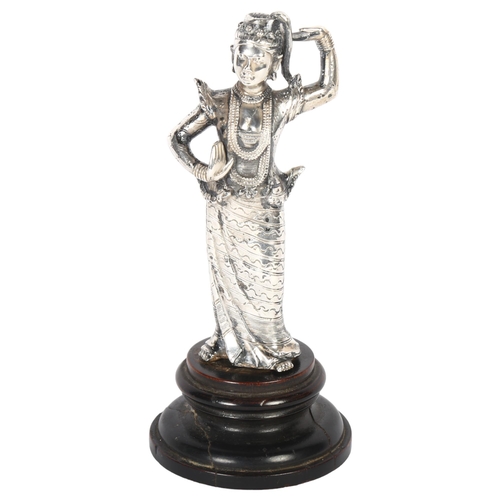 103 - A late 19th century? Burmese white metal figure, study of a deity on turned wood plinth, H17cm