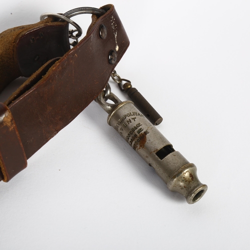 107 - An early 20th century boy scout's belt and buckle, together with a Metropolitan patent whistle, and ... 