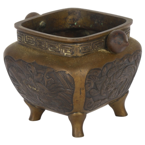 109 - A Chinese bronze censer, with relief carved panels and seal mark to the base, H8cm