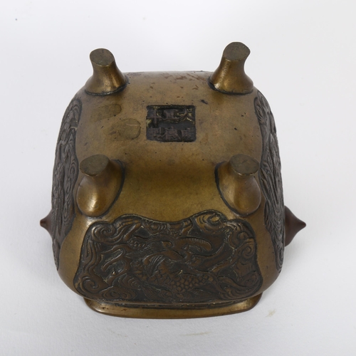 109 - A Chinese bronze censer, with relief carved panels and seal mark to the base, H8cm