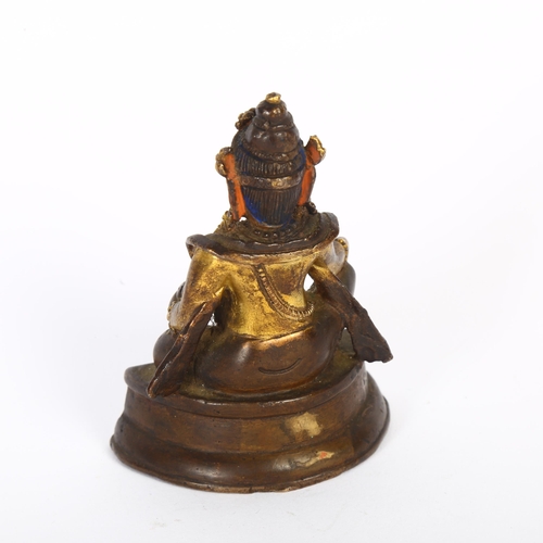 123 - A small Tibetan patinated bronze Jambhala, H9cm