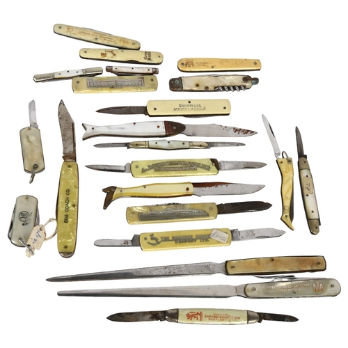 128 - A collection of ivorine and other handled advertising folding penknives and paper knives