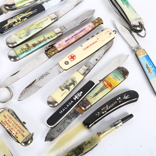 129 - A collection of folding pocket knives, all place named, including the Isle of Wight, Black Horse Pub... 