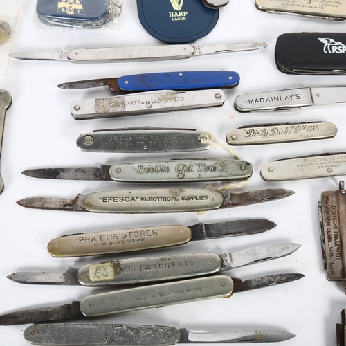 131 - A quantity of advertising pocket knives, including Booths Old Tom, Robin Starch, Worthington's etc