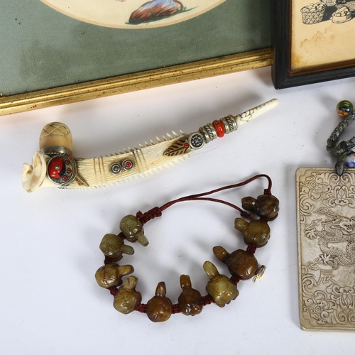 176 - A group of Oriental items, including a carved jade bracelet, an Opium pipe, circular print on silk e... 