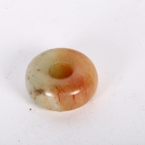 179 - A Chinese jade circular toggle, diameter 3cm