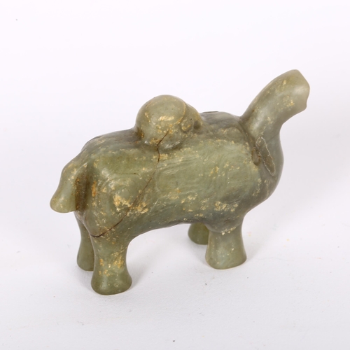 180 - A Chinese carved green jade elephant pendant, incised decoration, possibly Ming Dynasty, H4cm