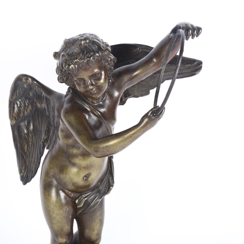 21 - A patinated bronze sculpture, study of Cupid on green marble base, H31cm