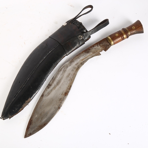 30 - A kukri knife and leather scabbard