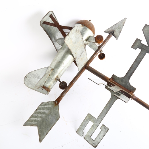 35 - A wrought-iron and pressed metal weather vane, surmounted by a bi-plane, overall height 115cm