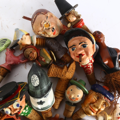 41 - A large quantity of novelty bottle stoppers, including Father Christmas, a Kinkibee character etc