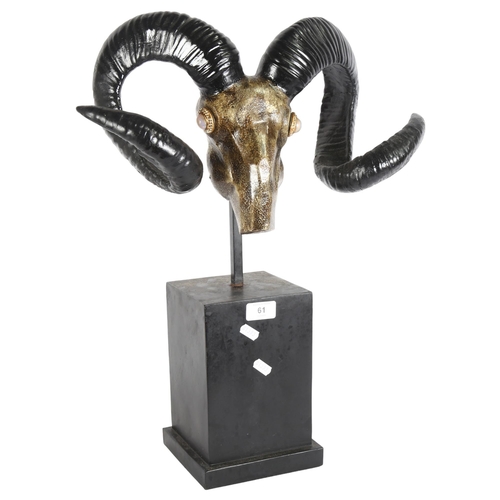 61 - A decorative composite ram's head and antlers, on plinth stand, overall height 56cm