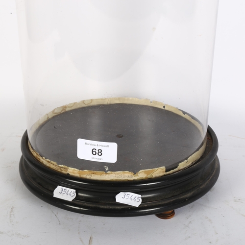 68 - A glass dome on circular turned wood base, H53cm