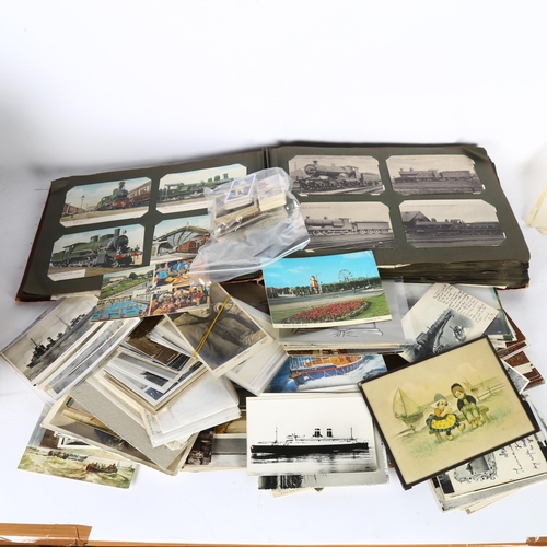 83 - An album of Vintage railway postcards (approx 400 postcards), and a quantity of loose postcards, and... 