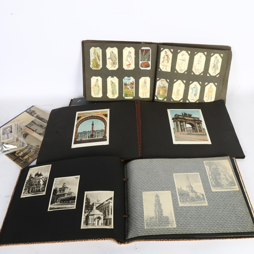 87 - 2 albums of Russian ephemera, photographs, postcards, and various albums of cigarette cards etc