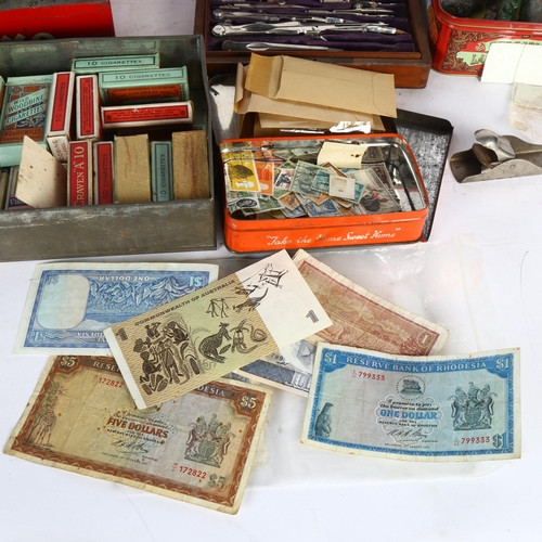 88 - A quantity of world banknotes, an early 20th century drawing set, cigarette cards, lead animals etc