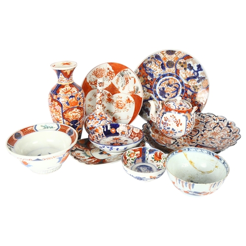 194 - A collection of Chinese Imari plates and bowls, a bottle neck vase etc