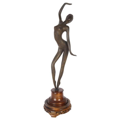 200 - A patinated spelter study of a female dancer, on turned wood stand, overall height 47cm