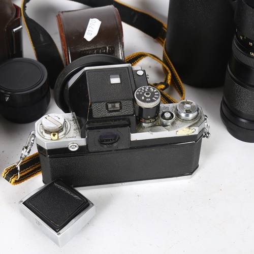 243 - A quantity of Vintage cameras and equipment, including a Nikon F, Nippon Kogaku camera, serial no. 6... 