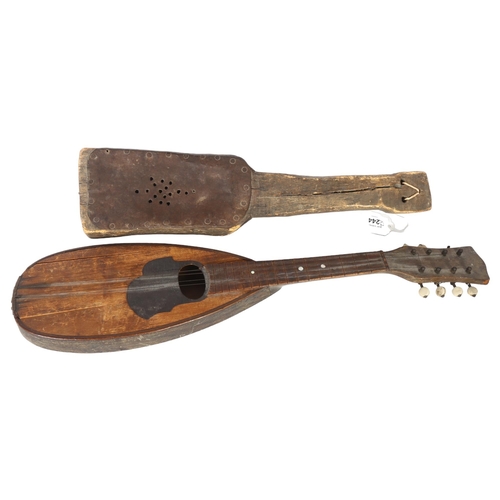 244 - A primitive mandolin style wooden string instrument, and a second Folk Art primitive wooden instrume... 