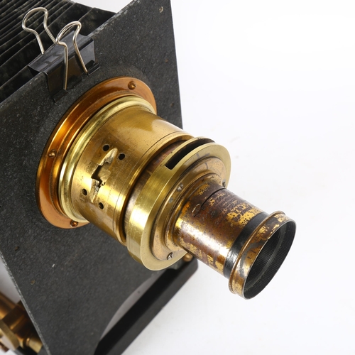 254 - A Victorian painted and brass-mounted magic lantern, with bellow slide, H34cm, base L30cm