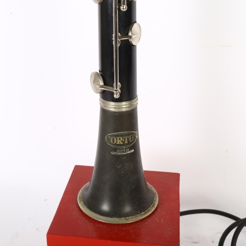 257 - A Corton Czechoslovakian clarinet that has been converted into a lamp, on a modern wooden base, H80c... 