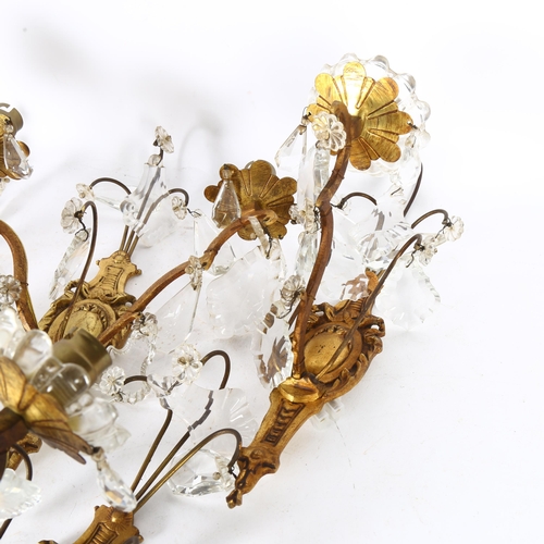 302 - A set of mid-20th century crystal hung gilded brass wall sconces, comprising 4 single light and 1 do... 