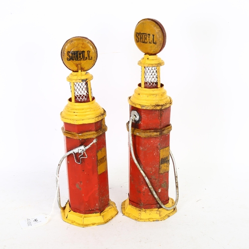 304 - A pair of Vintage toy tinplate petrol pumps for Shell Petrol, H29cm