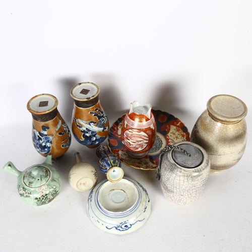 340 - A group of Oriental ceramics, to include 2 crackle glaze vases, H18cm, a small orange and gilt decor... 