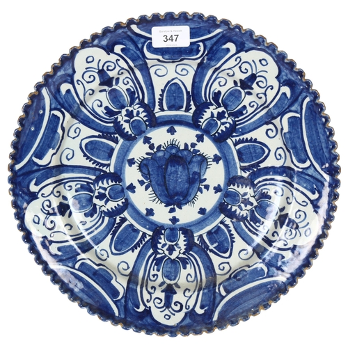 347 - A large blue and white Continental tin-glazed ceramic charger, diameter 34cm