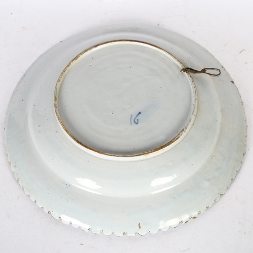 347 - A large blue and white Continental tin-glazed ceramic charger, diameter 34cm