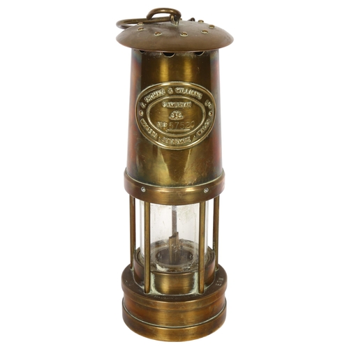 348 - E THOMAS & WILLIAMS LTD, OF CAMBRIAN - a brass miner's lamp, no. 57520, H25cm