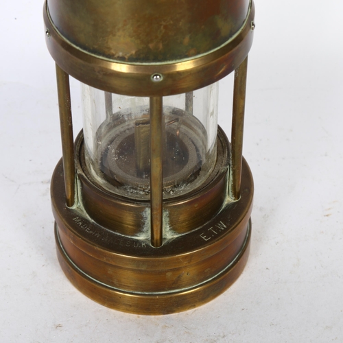 348 - E THOMAS & WILLIAMS LTD, OF CAMBRIAN - a brass miner's lamp, no. 57520, H25cm