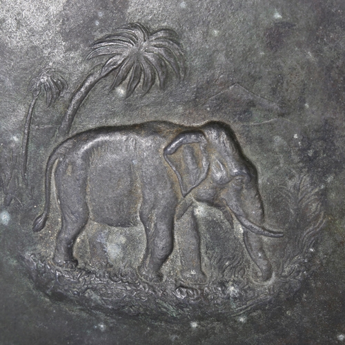 358 - A patinated bronze plate with African elephant embossed decoration, diameter 30cm