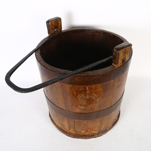 364 - A wooden metal-bound well bucket, height to rim of bucket 33cm