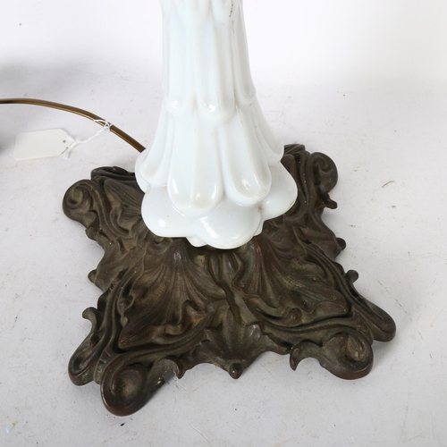 368 - An Art Nouveau milk glass Astral lamp, with cast metal base, height of lamp 90cm