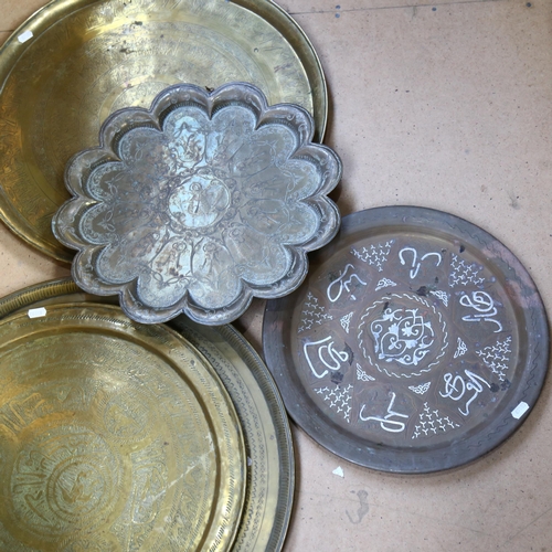 391 - 2 Eastern engraved brass trays, 57cm, 2 smaller brass trays, and a Cairo Ware tray